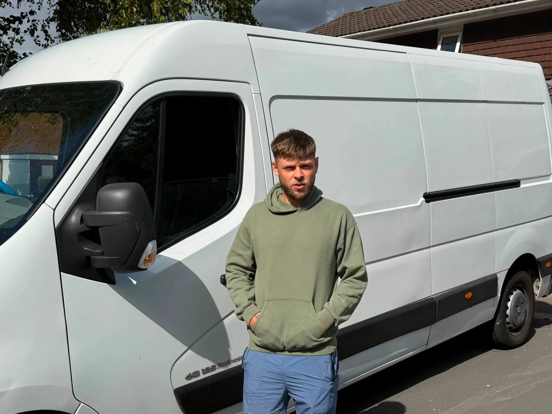 Josh from Hobberry Deliveries and Removals beside the van